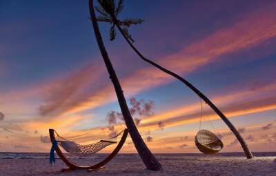 Hanging Lounger and Hammock at the beach in the evening